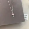 Luz colgante de corazón geométrico dulce rosa palo cadena de clavícula de circón de lujo versátil exquisita Saturno diseño de nicho collar