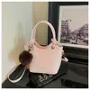 Bolso pequeño elegante transfronterizo para mujer, nuevo bolso de mano de nicho de moda, bolso cubo, estampado de leopardo retro, bolso de hombro único cruzado para el trabajo