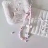 Pequena flor de nebulosa rosa fresco feita à mão estilo ins corrente para celular feminina corrente de celular simples pingente de câmera ccd