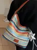 Bolso Tejido de Moda con Bloques de Color para Mujer 2026 Primavera Nuevo Estilo Ins Simple Casual Bolso Cubo Elegante Bolso de Hombro