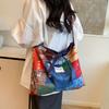 Bolsa Tote Color-Blocking Graffiti para Mulheres 2025 Nova Primavera Grande Capacidade Estilo Étnico Patchwork Bolsa de Ombro Único Transversal