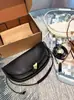 Bolsa de media luna al por mayor transfronteriza modelo nuevo 2026 bolsa tipo dumpling de piel de vaca suave bolsa de axila de cuero genuino a la moda bolso de hombro cruzado