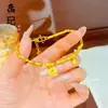 Pulsera de pepitas de oro estilo tienda de oro con diseños de pata de gato, pentagrama, terrón de azúcar y trébol de cuatro hojas, joyería de mujer moderna y versátil al por mayor