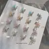 Nuevo taladro de uñas de circón Qiansi Mengdie decoraciones de alas de mariposa de doble ala tridimensionales para uñas venta al por mayor