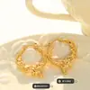 Pendientes de círculo dorado repujado con forma especial de acero de titanio europeo y americano diseño de nicho femenino pendientes de alta calidad pendientes únicos F650