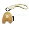 Venta al por mayor transfronteriza de llaveros japoneses y coreanos con letras en inglés, dijes para bolso de cuero dopamina, pequeños accesorios y regalos