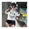 Ropa de Verano Holgada de Manga Corta para Niños Traje Infantil 2026 Nuevo Estilo Coreano para Bebé Conjunto de Dos Piezas con Jeans Rasgados Frescos