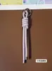 Llavero de cordón de cuero PU transfronterizo, colgante versátil para bolso, accesorios de decoración para botellas de agua y muñecas DIY, llaveros al por mayor