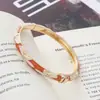 Nuevo brazalete estilo chino de esmalte con goteo de aceite para mujer, pulsera versátil pintada artísticamente vintage, superventas transfronterizo, joyería de moda de lujo ligero