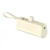 Mini Power Bank Cápsula Transfronteiriço 10.000 mAh com Cabo Embutido Power Bank Portátil Compacto Presente Venda por Atacado Carregamento Rápido