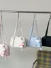 Bolso de Mano Pequeño de Alta Gama Transfronterizo para Mujer, Nuevo Bolso Versátil de Hombro o Axila Primavera 2026, Popular Bolso Tote Cruzado