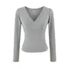 Camiseta rosa de manga larga con cuello cruzado para mujer, adecuada para principios de otoño, con diseño entallado a la cintura, elegante y versátil, top corto