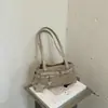 Bolso de axila retro de moda transfronterizo para mujer, nueva colección 2026, diseño de alta gama, estilo de nicho, elegante, adecuado para el trabajo, se puede llevar en la mano o usar como bolso de hombro