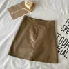 Minifalda negra, nuevo estilo de verano y otoño para mujer, de cintura alta, adelgazante, falda corta de cuero PU, anti-exposición, línea A, bodycon