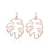 Aretes transfronterizos de venta caliente estilo étnico aretes simples retro huecos de hoja aretes modernos personalizados de hoja de plátano para mujer