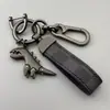 Chaveiro de Dinossauro Fofo Desenho Animado Pingente de Metal Estilo Casal para Carro Masculino Chaveiro de Corda de Couro de Alta Qualidade para Pendurar na Cintura