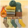 Calcetines para niños engrosados calcetines de rizo para niños de tubo alto calcetines para niños invierno terciopelo cálido calcetines para bebé calcetines de nieve