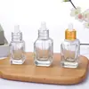 Atacado de fábrica frasco quadrado transparente espesso para óleo essencial frasco de sub-embalagem cosmética frasco conta-gotas frasco de essência frasco de vidro vazio