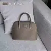 Bolso de mano para mujer, primavera y verano 2023, de piel auténtica, sencillo, moderno, informal, retro, portátil.