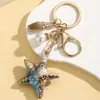 Creativo Vida Marina Colorido Halo Perla Estrella de Mar Llavero Colgante Lindo Colorido Estilo Océano Adorno de Estrella