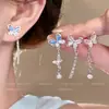 Aretes Asimétricos de Mariposa con Borla y Piedra Ojo de Gato para Mujer, Estilo Súper Hada, Diseño Único y Elegante, Aretes Impresionantes