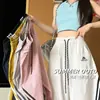 Moda urbana nueva de otoño, pantalones anchos bordados estilo americano con elegante diseño de cordón de cintura alta, pantalones deportivos de secado rápido con tres rayas