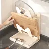 El fabricante suminista un estante de cocina multifuncional sin taladro para tapas de ollas, un soporte vertical para tabla de cortar para uso doméstico