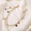 Nuevo llavero con cadena de cuero estilo Chanel con perlas para teléfono, portátil, resistente a caídas, de aluminio, para mujer