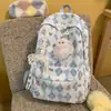 Mochila de estilo japonés con estampado floral dulce, gran capacidad, ligera, versátil y perfecta para niñas; presenta un lindo dije de peluche