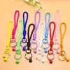 Lanyard de pentagrama con cascabel estilo deportivo moderno, accesorio versátil para bolsos, muñecas y fundas de teléfono, venta al por mayor
