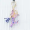 Suministra y Vende Llaveros Morados con Forma de Corazón de 26 Letras con Borlas de Mariposa, Colgantes para Llaves y Colgantes para Bolsos de Mujer