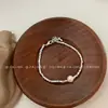Pulsera Única de Fragmento de Plata y Perla con un Estilo de Lujo Ligero de Alta Gama, Presentando un Diseño Minimalista Sencillo y Versátil