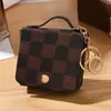 Bolsa cuadrada pequeña portátil creativa lista para usar con llavero, bolsa de almacenamiento para auriculares Bluetooth, monedero para almacenamiento de auriculares Bluetooth