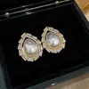 Pendientes de Perla de Circonita de Moda de Aguja Plateada Pendientes de Botón Retro de Lujo Ligero de Nicho Francés Pendientes Nuevos 2026