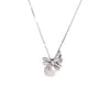 Diseño Femenino y Versátil Collar de Perlas Redondas con Lazo Cadena para Suéter Plateada Completa