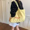 2026 Nuevo Estilo Coreano Nicho Estampado de Letras Gran Capacidad Ligero Casual Bolso Tote para Estudiantes para Usar en Clase