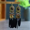 Gran oferta de pendientes de plumas vintage de estilo étnico, largos y multicolores, con diseño de cuentas y círculos.