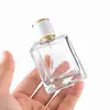 Botella pulverizadora cuadrada dispensadora de perfume 30ml 50ml 100ml vidrio de alta transparencia botella vacía botella dispensadora de presión portátil