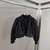 Ropa de mujer transfronteriza 2026 nuevo producto estilo europeo y americano moderna versátil manga abullonada cuello medio cremallera chaqueta corta para mujer