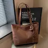 Bolsa de mano minimalista transfronteriza, nuevo estilo 2026, gran capacidad, bolso de hombro moderno, texturizado, casual y adecuado para el trabajo, se puede llevar debajo del brazo