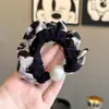 Elástico de Cabelo Pequeno Intestino com Estampa de Leopardo e Pérolas para Mulheres Simples Moda Versátil Corda de Cabelo 2026 Novo Estilo Coreano Acessórios de Cabelo Durável Não Danifica o Cabelo