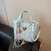 Bolsa pequena popular e moderna para mulheres, bolsa transversal casual versátil nova para o verão de 2026, bolsa de mão estilo coreano tipo balde