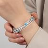 Francés Nuevo estilo retro lujo ligero estilo compuesto acero de titanio chapado en oro de 18 quilates hueco diamante turquesa pulsera joyería al por mayor