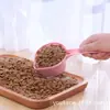 Cuchara para comida de gato y perro de mascota cuchara pala de plástico portátil suministros para comida de mascota fabricantes al por mayor color