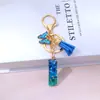 A- Z Gradiente Azul Letra Colgante Mariposa Borla Colgante Bolso de Niña Colgante Transfronterizo Caliente Recuerdo