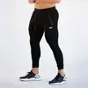 Otoño e invierno Europa y Estados Unidos transfronterizo nuevos pantalones fitness ocio running deportes entrenamiento hombres pie pequeño pantalones ajustados