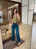 Novo Top Outono Estilo Europeu Guangzhou Treze Linhas Calça Baguette de Nove Pontos Jeans Cor Original de Denim com Cinto 61860