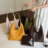 Bolso de hombro tejido a cuadros retro transfronterizo 2026 nuevo bolso tote de nicho de moda con pequeño bolsillo interior, bolso casual de gran capacidad para el hombro