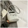 Bolsa de mão feminina de laço nicho 2026 nova textura de couro oleado bolsa de balde moderna para o dia a dia bolsa transversal para o trabalho