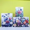 Bolsa de Mão com Flores Prata Quente Cartão Branco em estoque Saco de Embalagem de Papel para o Dia das Mães Saco de Presente para o Festival da Deusa das Mulheres 8 de Março